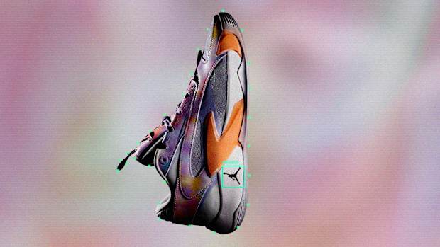 Side view of Luka Doncic's purple and orange Jordan Brand shoes.